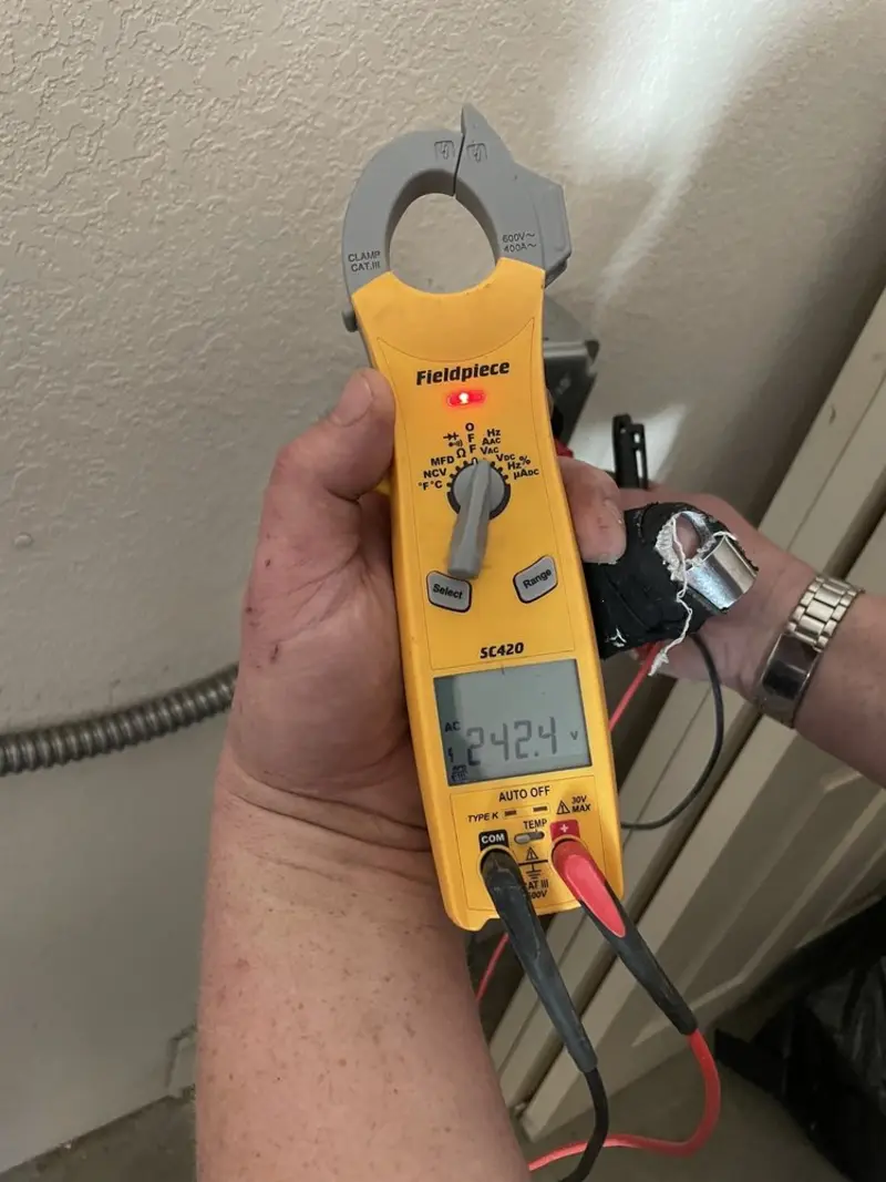 Voltage testing with clamp meter during Electrical Installation Services in West Memphis